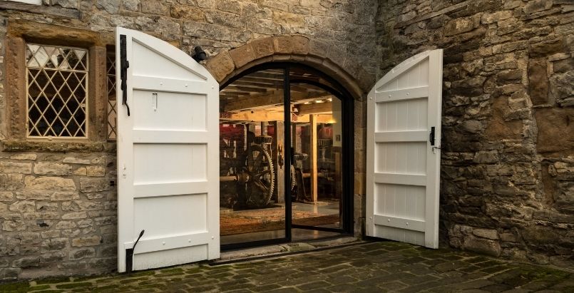 Arched steel exterior door on farm house
